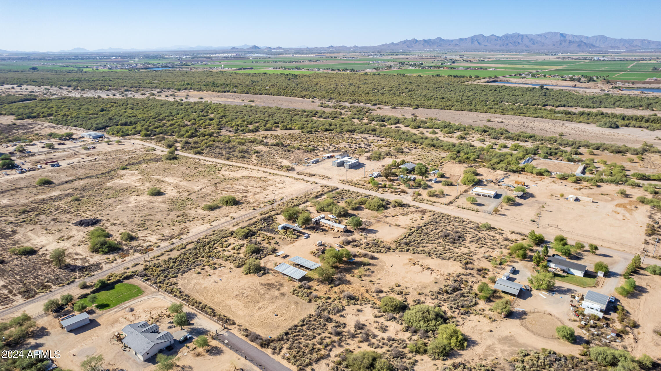 21235 West Elliot Road Buckeye, AZ 85326 - Photo 15 of 16 a view of lake with mountain and trees in the background