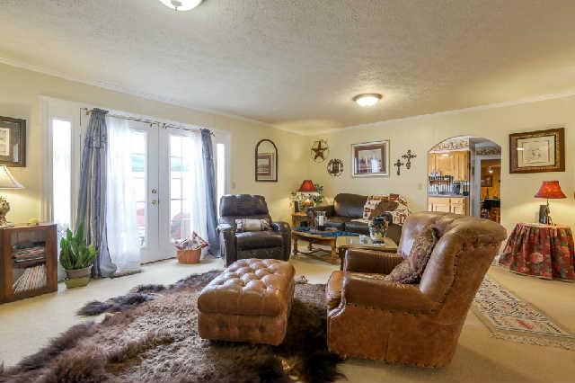 2039 Abiff Road Burns, TN 37029 - Photo 4 of 20 Family room complete with a fireplace and french doors leading out to the patio.