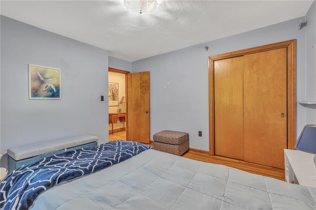 250 Neville Road Beaver, PA 15009 - Photo 15 of 25 Owners bedroom continues with hardwoods and large closet.