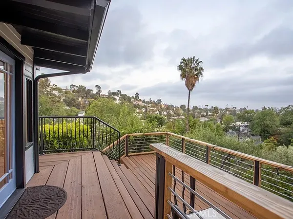 a view of balcony with couches