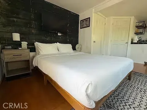 a bed room with a bed and a night stand