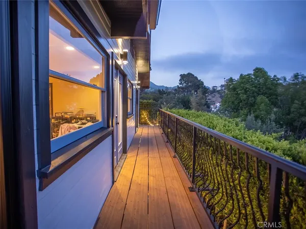 a view of balcony with wooden floor