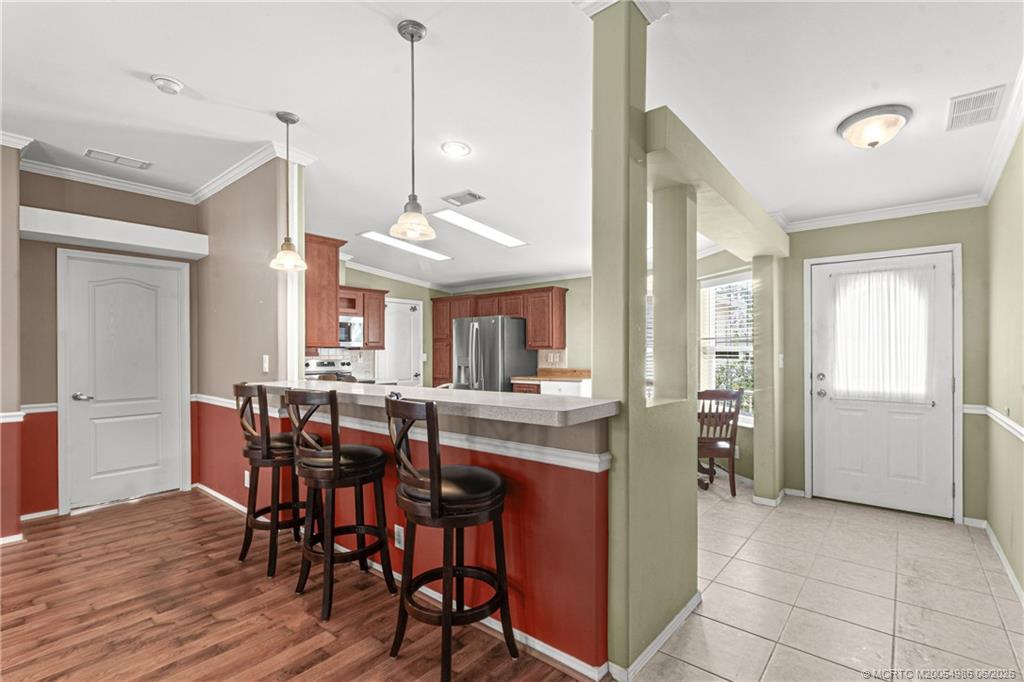 4237 4th Court Lantana, FL 33462 - Photo 6 of 40 a view of a dining room with furniture window and wooden floor