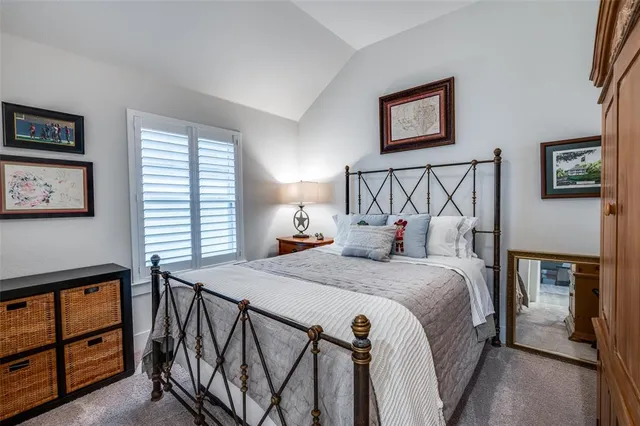 a bed room with a bed and a night stand