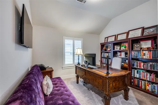 a bedroom with furniture and a book shelf