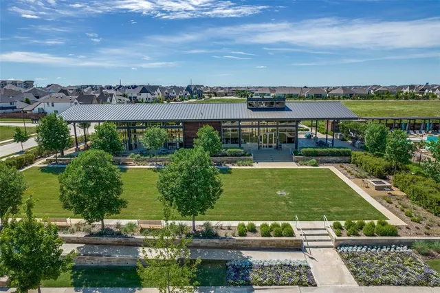 an aerial view of a house with swimming pool patio and outdoor seating