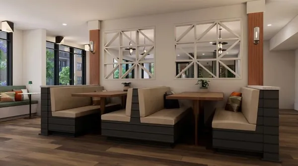 a kitchen with stainless steel appliances kitchen island granite countertop a refrigerator a sink dishwasher a stove and a dining table with wooden floor