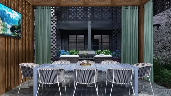a group of table and chairs under an umbrella in front of building