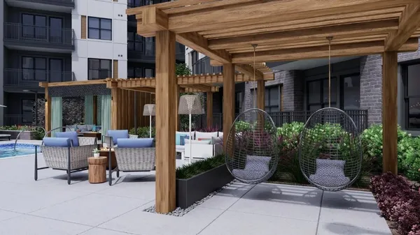 a view of building with porch and seating space