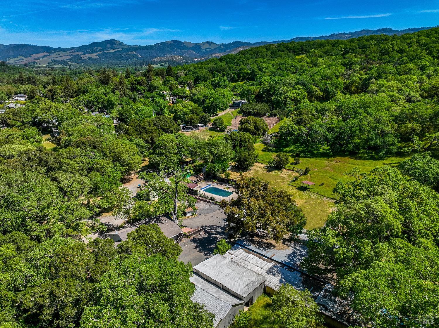 Hidden acreage in downtown Glen Ellen with multiple parcels and homes. Adjoins Sonoma Valley Regional Park, public water, annexed to sewer district. Around the corner from downtown, incredible views.