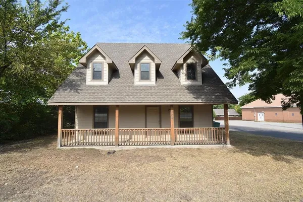 a front view of a house with garage