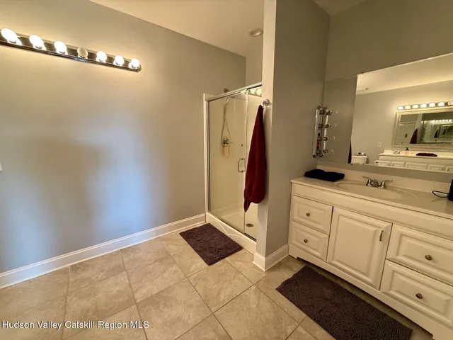 a view of a bathroom with a sink and mirror
