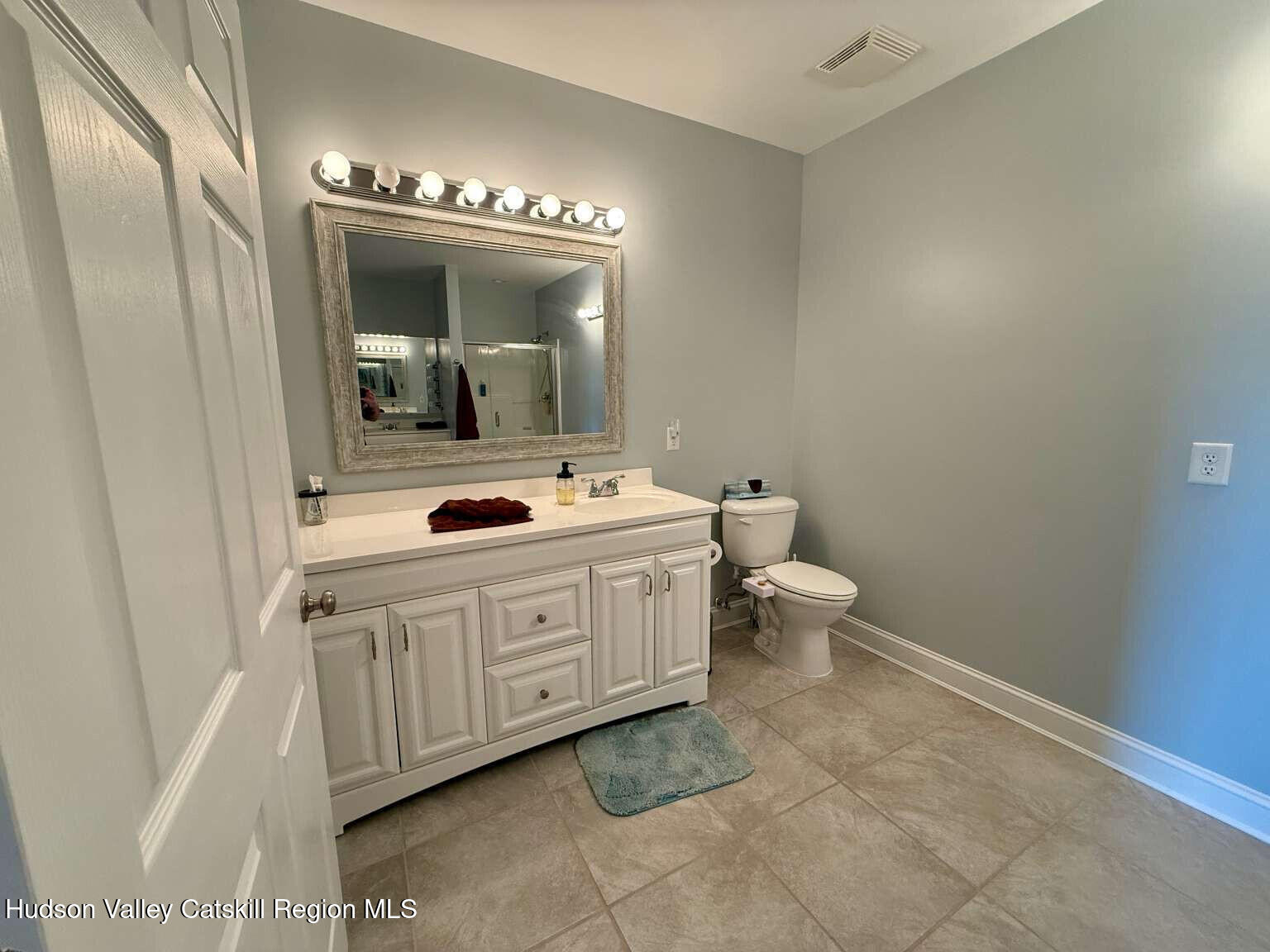30 Aevo Road Accord, NY 12404 - Photo 14 of 41 a spacious bathroom with a double vanity sink mirror and toilet