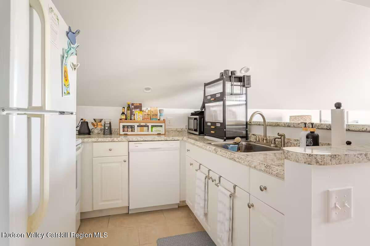 30 Aevo Road Accord, NY 12404 - Photo 24 of 41 a kitchen with cabinets a sink and appliances