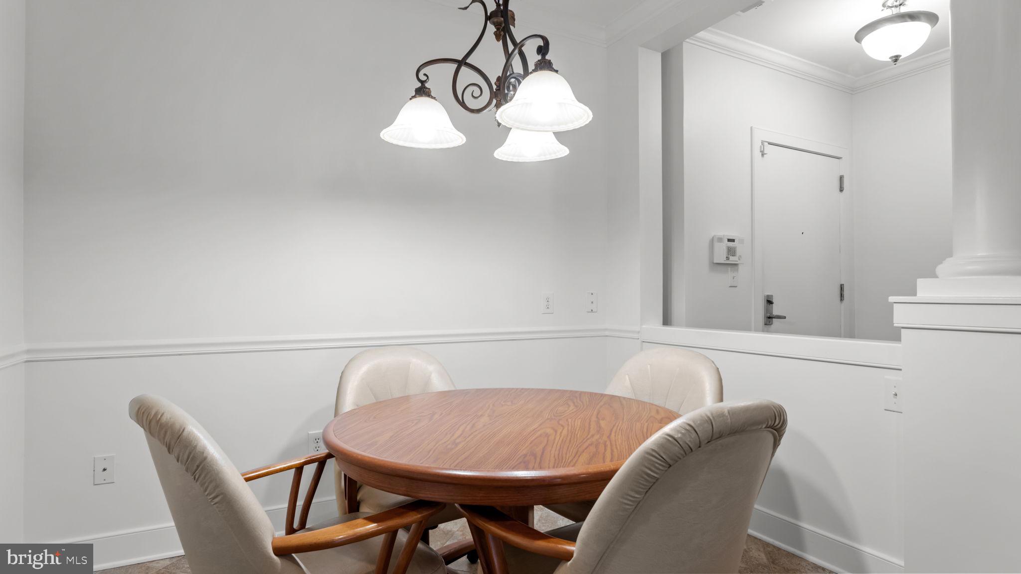 2102 Meridian Boulevard Warrington, PA 18976 - Photo 11 of 29 a view of a dining room with furniture and wooden floor
