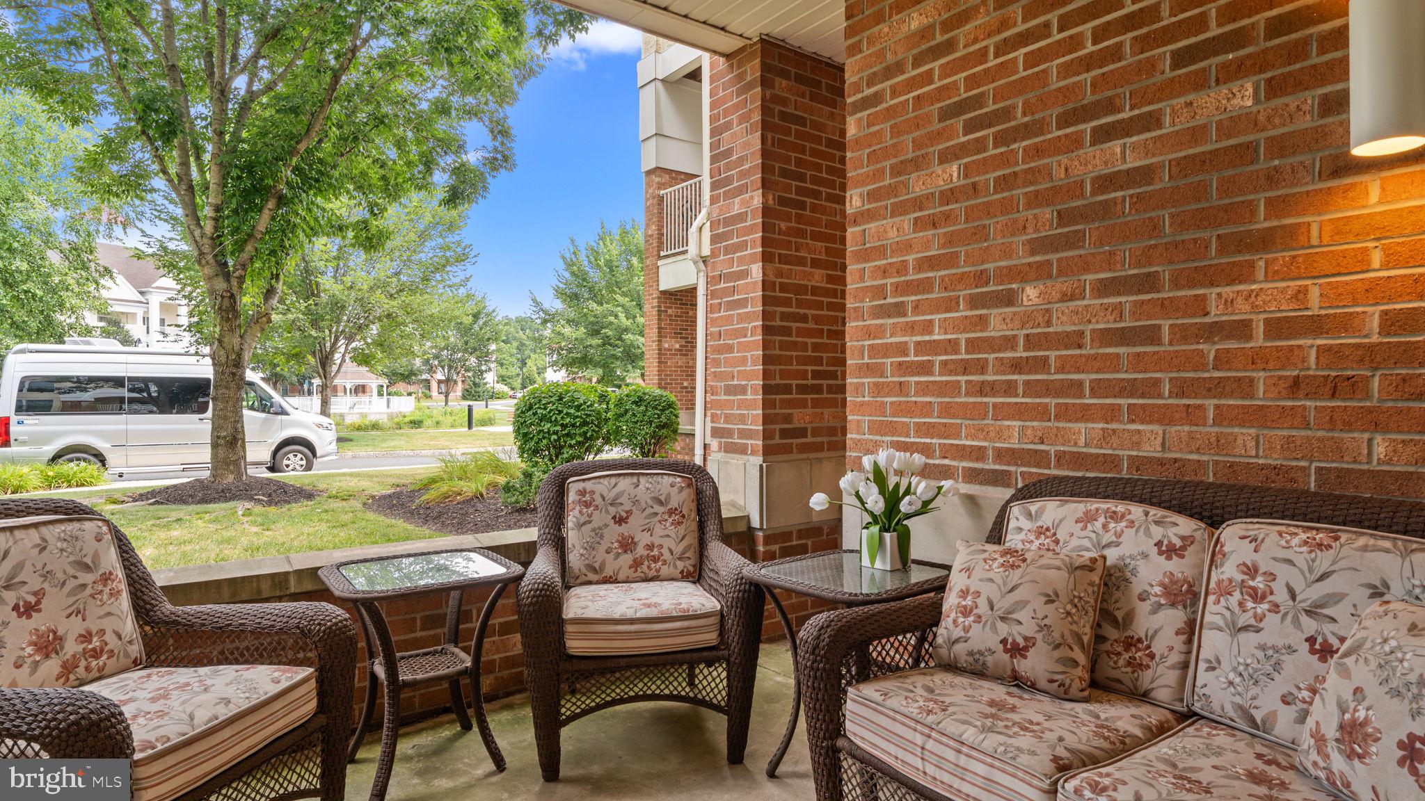 2102 Meridian Boulevard Warrington, PA 18976 - Photo 25 of 29 a view of a patio with table and chairs and potted plants