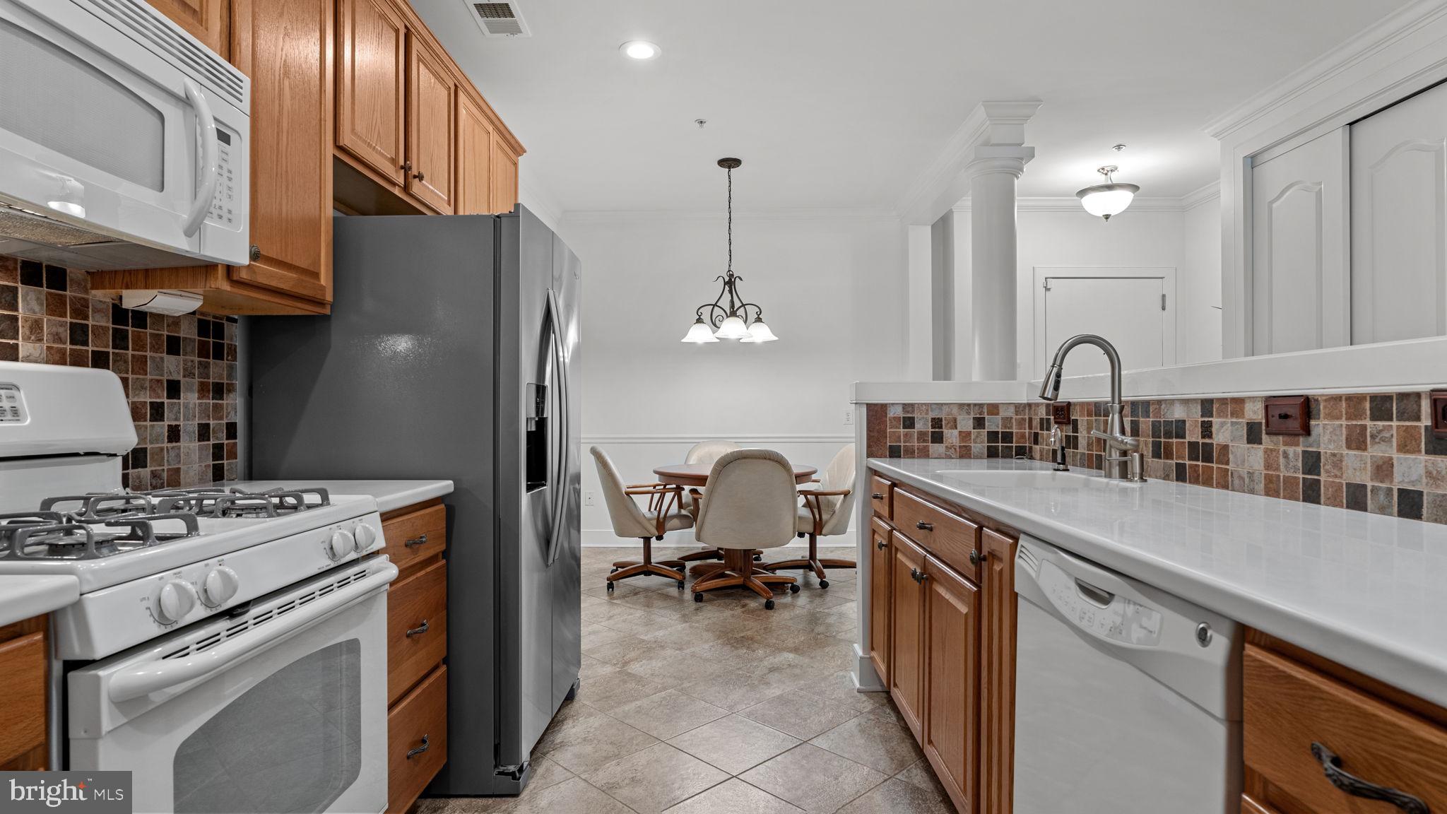 2102 Meridian Boulevard Warrington, PA 18976 - Photo 10 of 29 a kitchen with a sink stove and cabinets