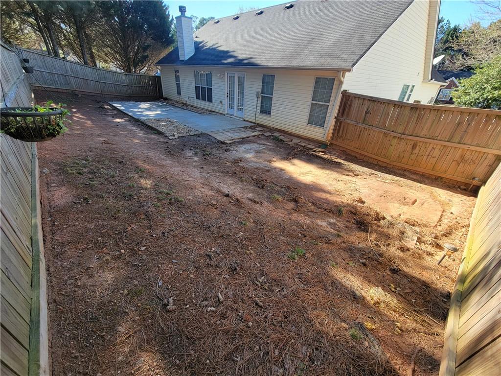 2213 Carlton Chase Road Dacula, GA 30019 - Photo 28 of 30 a view of a backyard of the house
