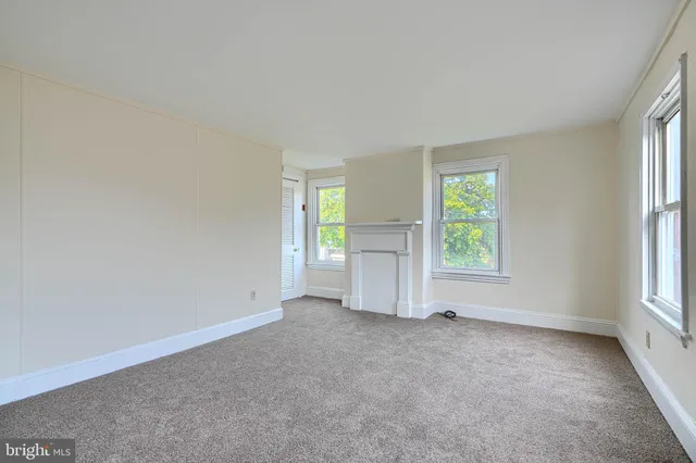 an empty room with windows