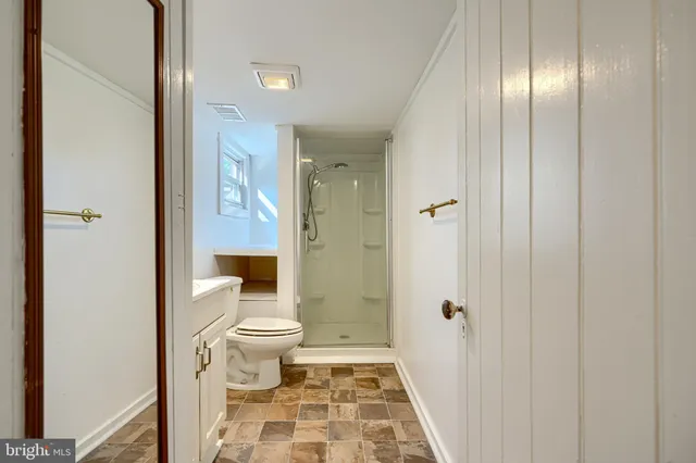 a bathroom with a sink and toilet