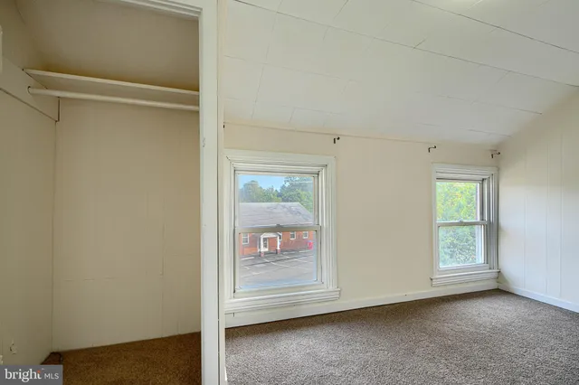 a view of a room that has a window in it