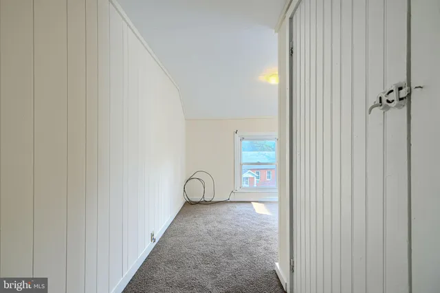 a view of a bathroom with a shower and a sink
