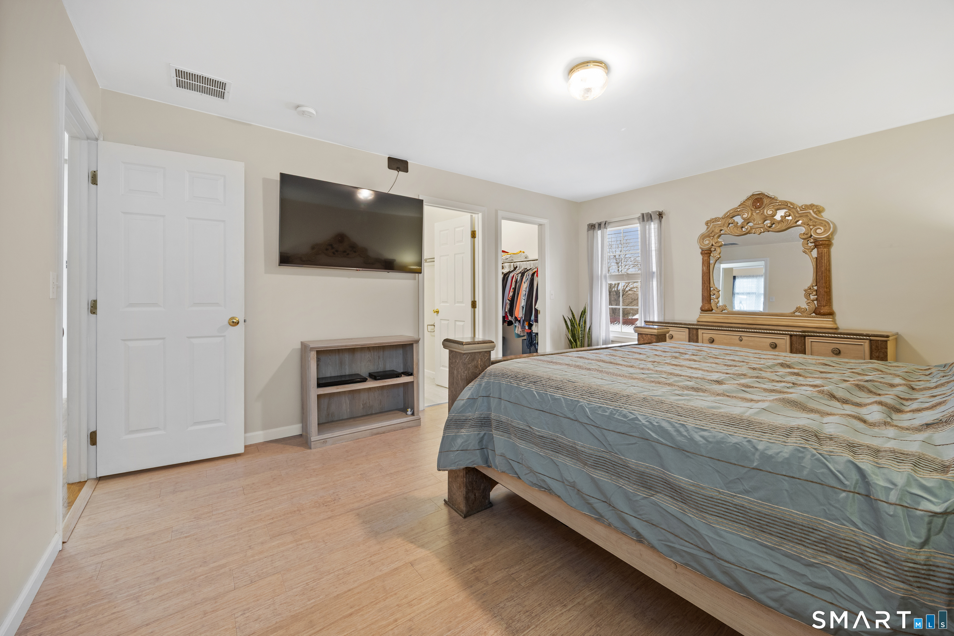 50 Paxton Street Watertown, CT 06779 - Photo 15 of 38 a spacious bedroom with a bed and a flat screen tv