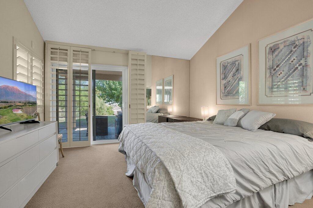 72302 Blueridge Court Palm Desert, CA 92260 - Photo 12 of 49 a spacious bedroom with a large bed and a large window
