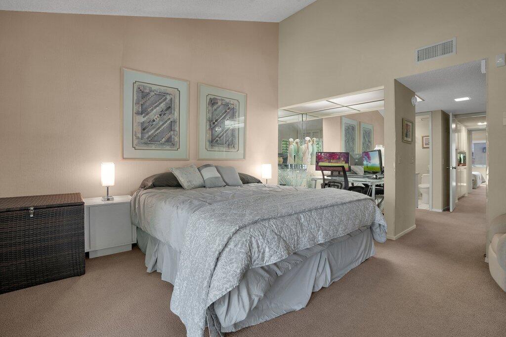 72302 Blueridge Court Palm Desert, CA 92260 - Photo 13 of 49 a spacious bedroom with a bed and a dresser