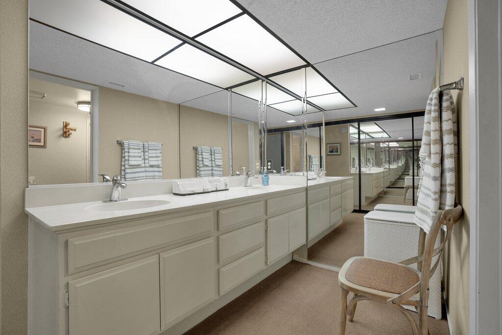 72302 Blueridge Court Palm Desert, CA 92260 - Photo 15 of 49 a bathroom with a sink a toilet and mirror