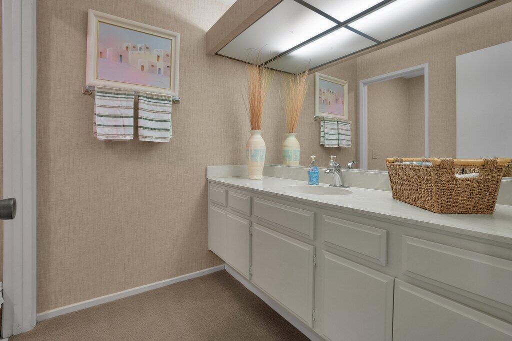 72302 Blueridge Court Palm Desert, CA 92260 - Photo 18 of 49 a bathroom with a sink and a mirror