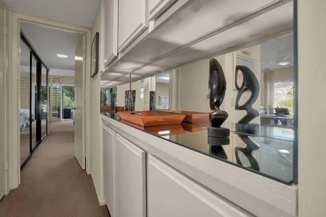 a view of a hallway with mirror