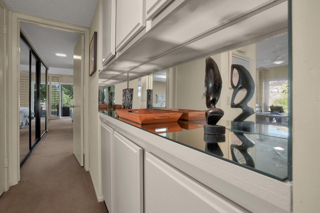 72302 Blueridge Court Palm Desert, CA 92260 - Photo 20 of 49 a view of a hallway with mirror