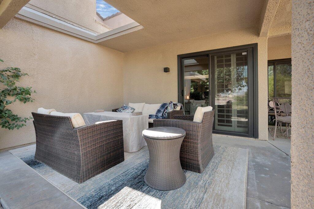 72302 Blueridge Court Palm Desert, CA 92260 - Photo 2 of 49 a view of a living room and dining room