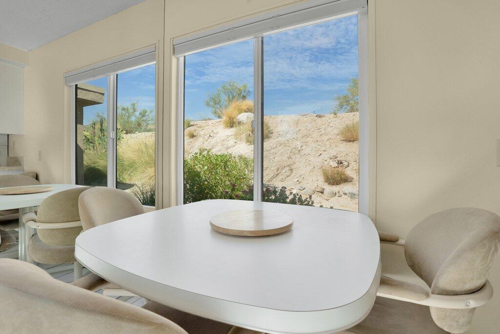 72302 Blueridge Court Palm Desert, CA 92260 - Photo 25 of 49 a dining room with furniture and wooden floor