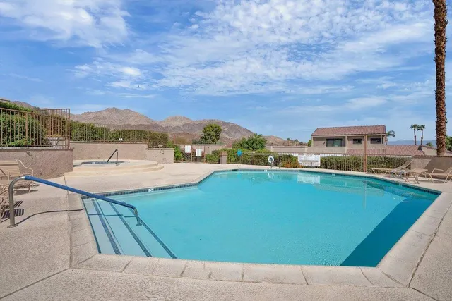 a view of a swimming pool with a terrace