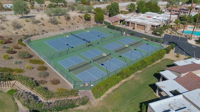 an aerial view of a house with a garden