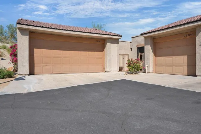 a view of a livingroom with furniture and an window