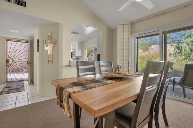 a view of a dining room with furniture and a table