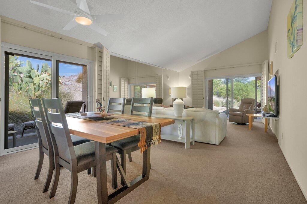 72302 Blueridge Court Palm Desert, CA 92260 - Photo 9 of 49 a view of a dining room with furniture and a large window