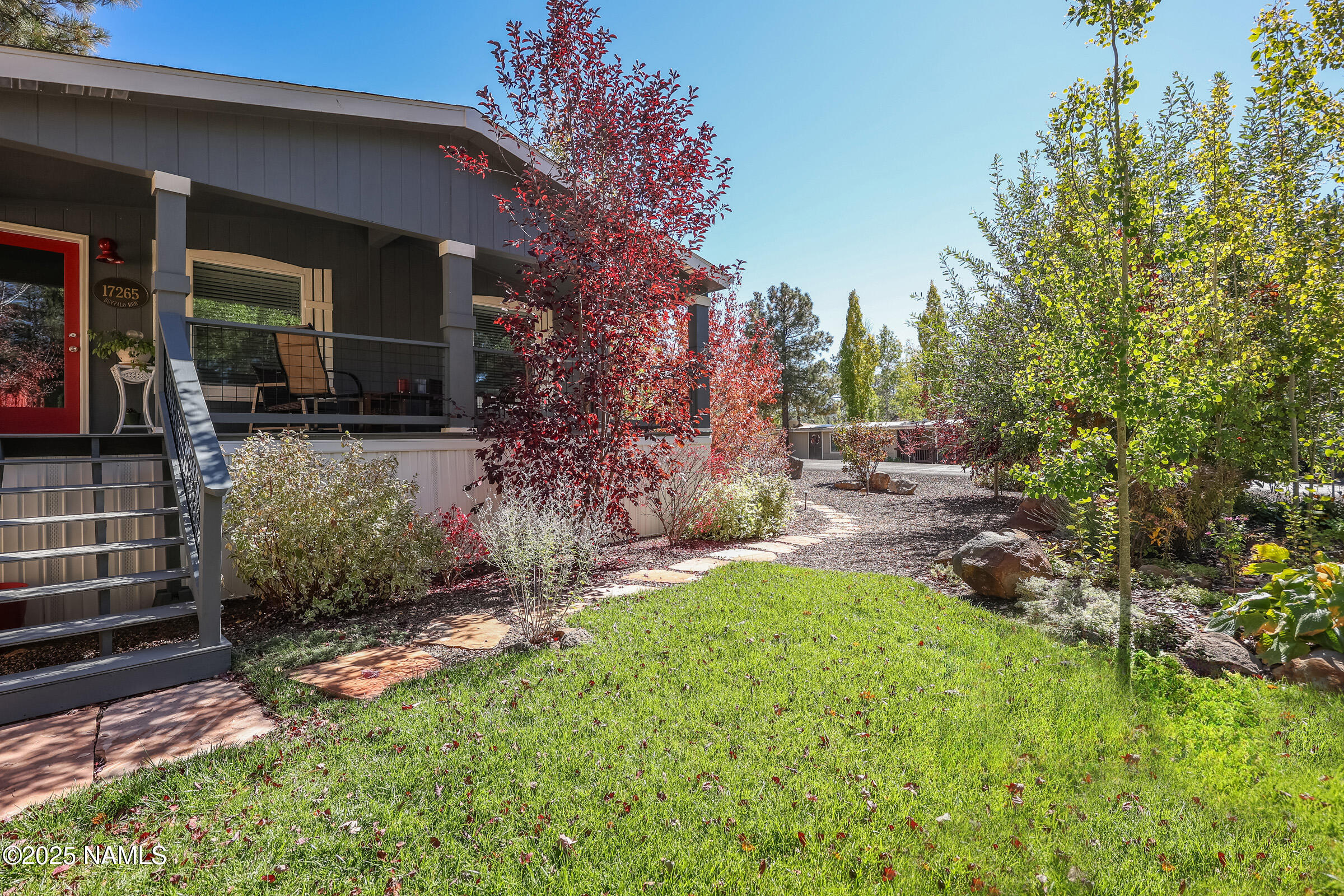 17265 Buffalo Run Munds Park, AZ 86017 - Photo 1 of 51 a view of backyard with a table and chairs and potted plants