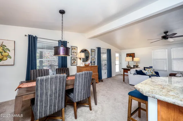 a view of a livingroom with furniture window and wooden floor