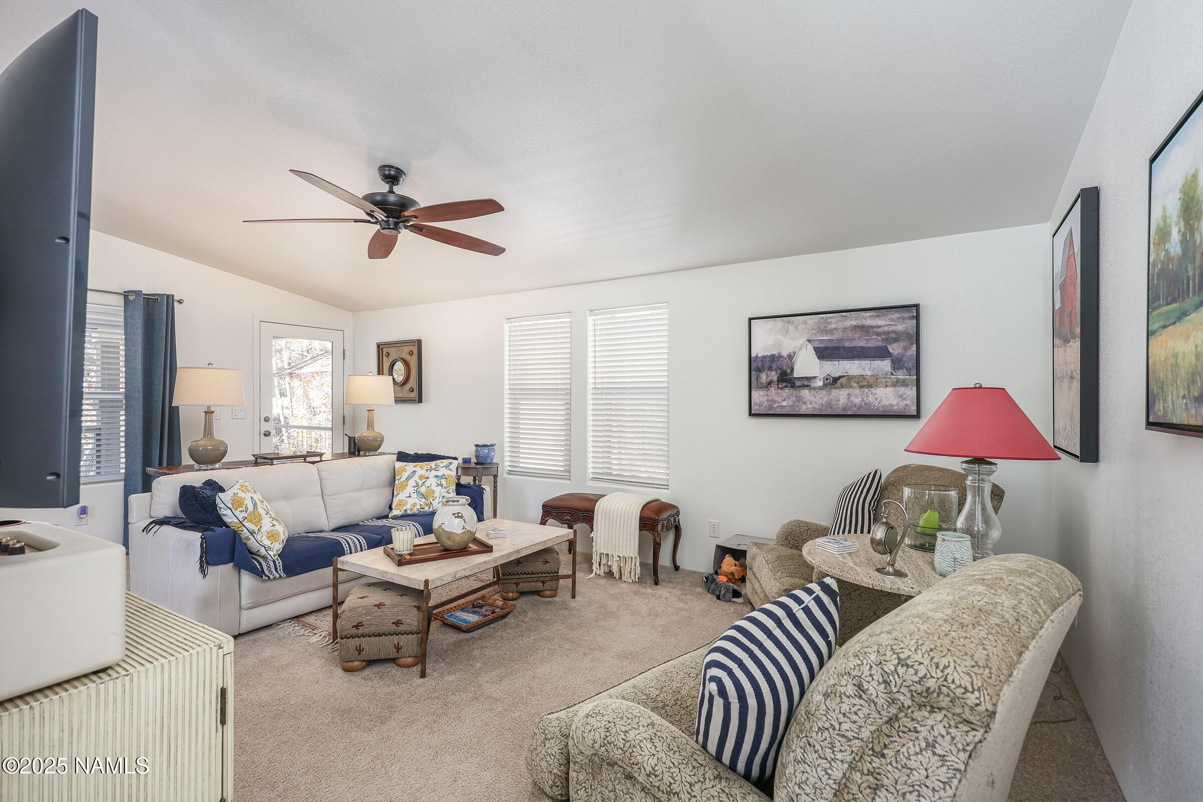 17265 Buffalo Run Munds Park, AZ 86017 - Photo 15 of 51 a living room with furniture and a chandelier