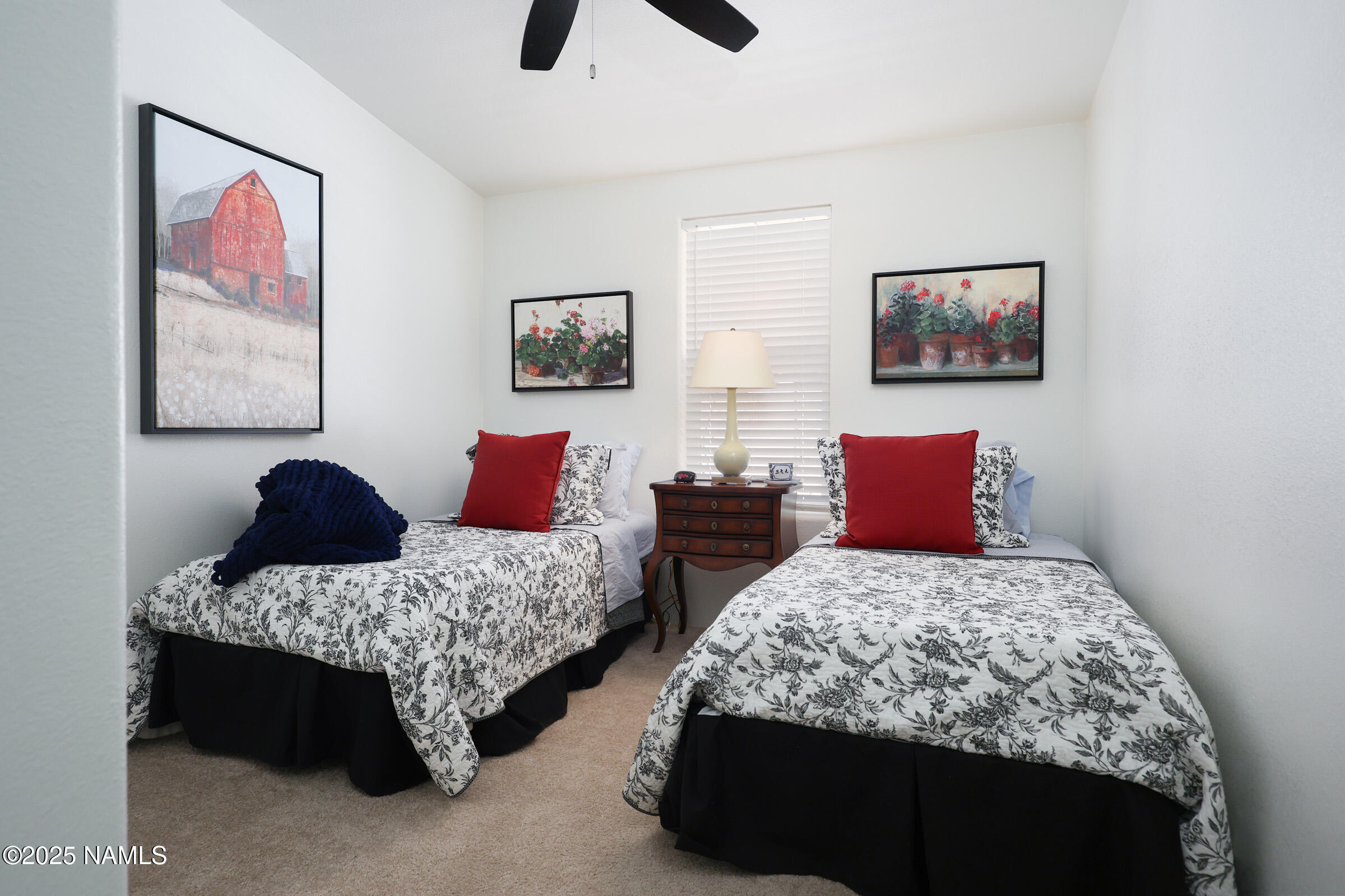 17265 Buffalo Run Munds Park, AZ 86017 - Photo 18 of 51 a bedroom with two beds and painting on the wall