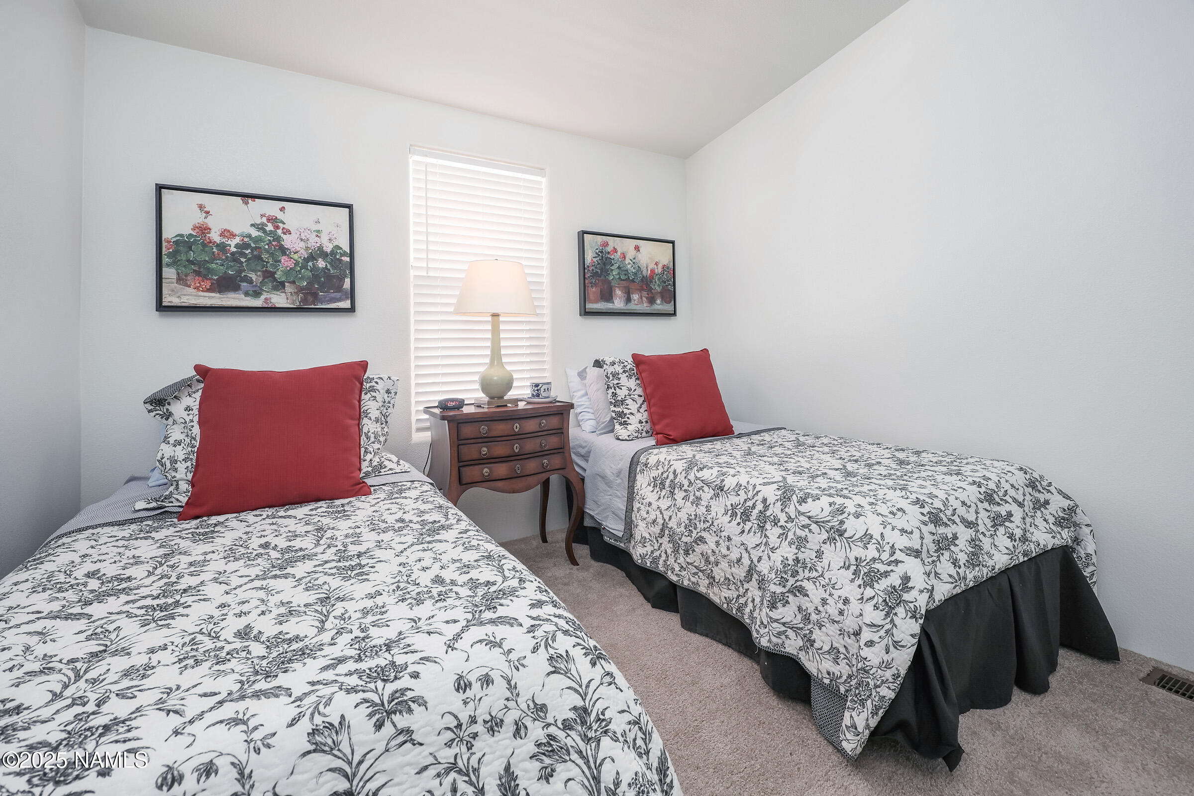 17265 Buffalo Run Munds Park, AZ 86017 - Photo 19 of 51 a bedroom with bed and a window