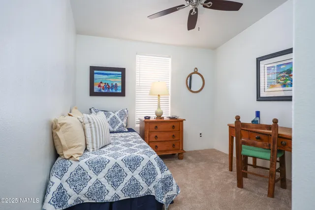 a bedroom with a bed and a chair