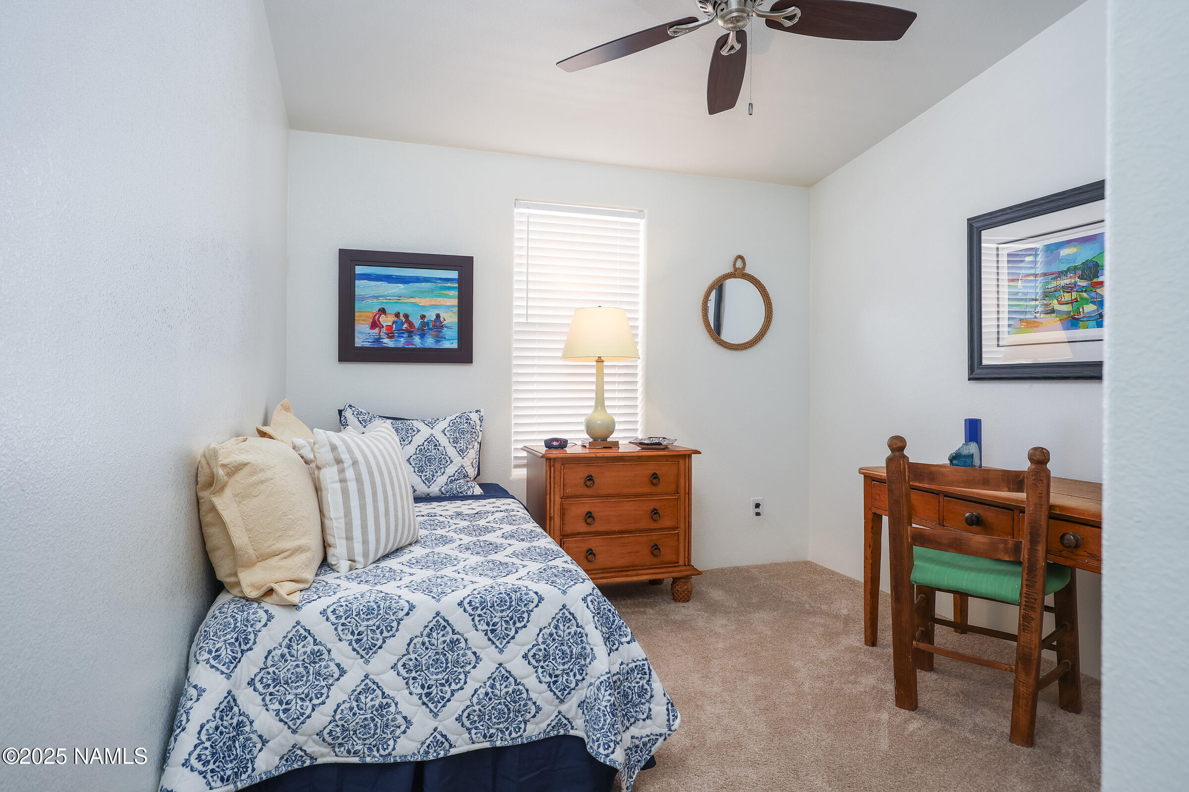 17265 Buffalo Run Munds Park, AZ 86017 - Photo 21 of 51 a bedroom with a bed and a chair
