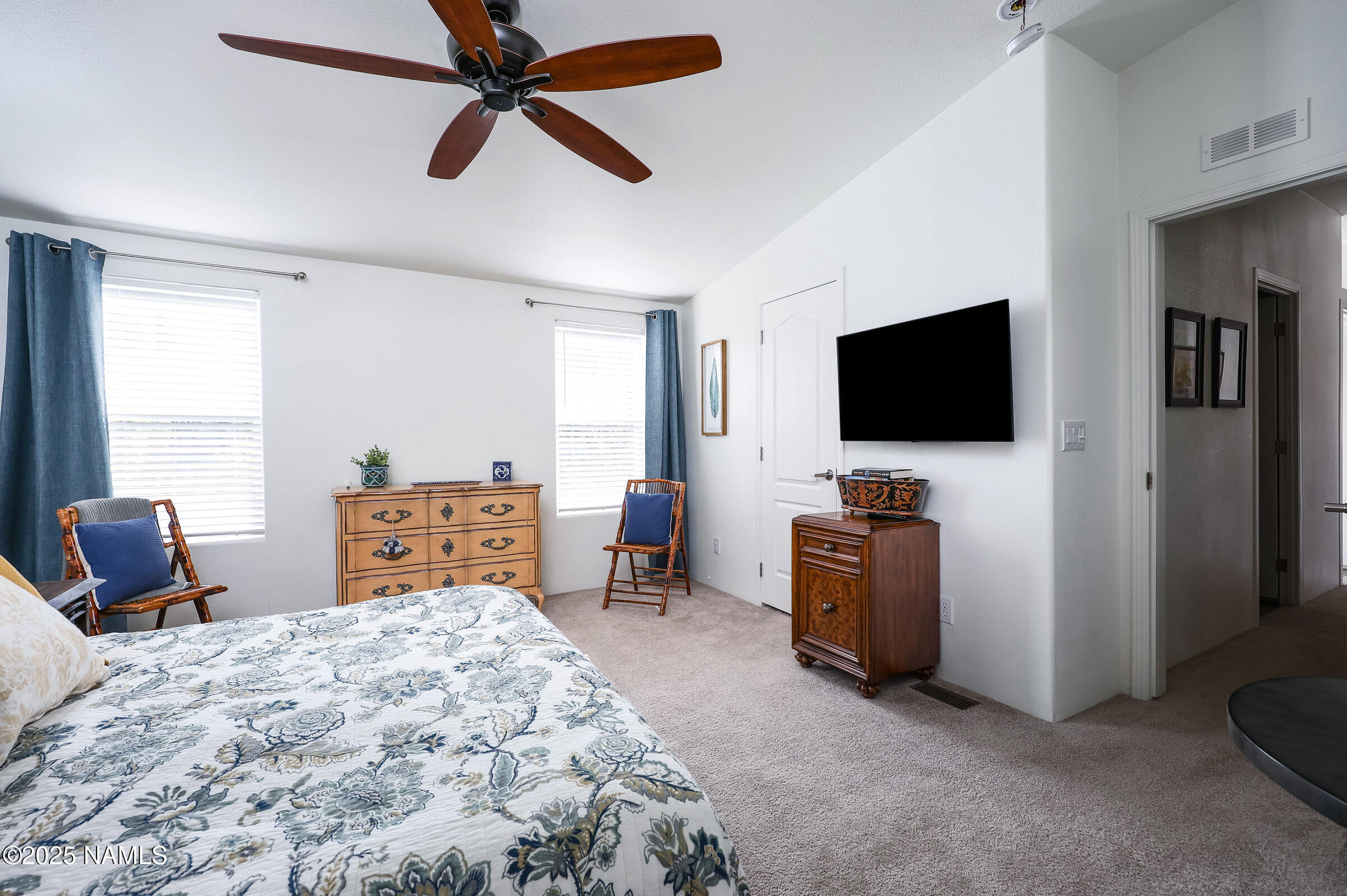 17265 Buffalo Run Munds Park, AZ 86017 - Photo 30 of 51 a bedroom with furniture and a flat screen tv