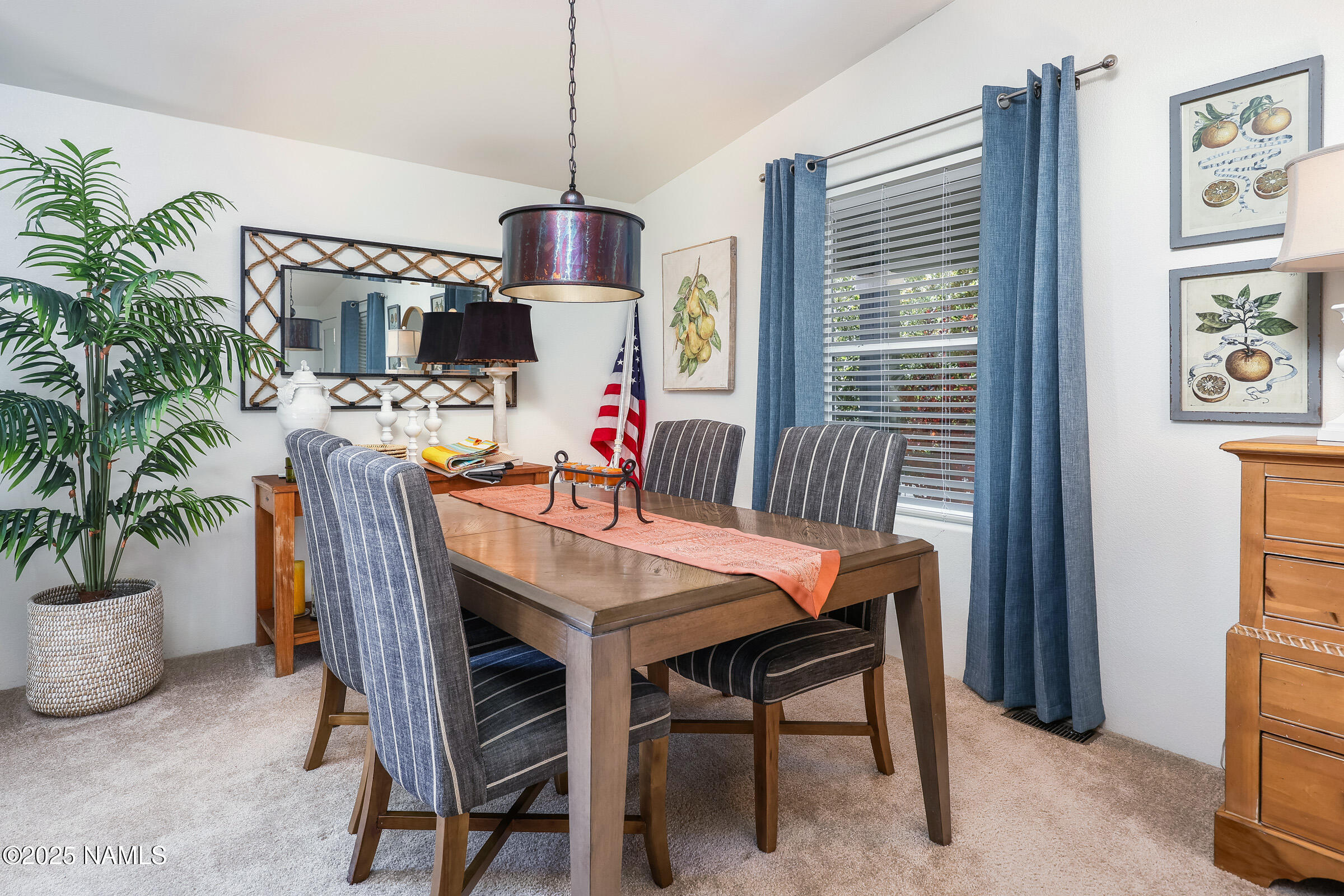 17265 Buffalo Run Munds Park, AZ 86017 - Photo 4 of 51 a dining room with furniture potted plants and kitchen view