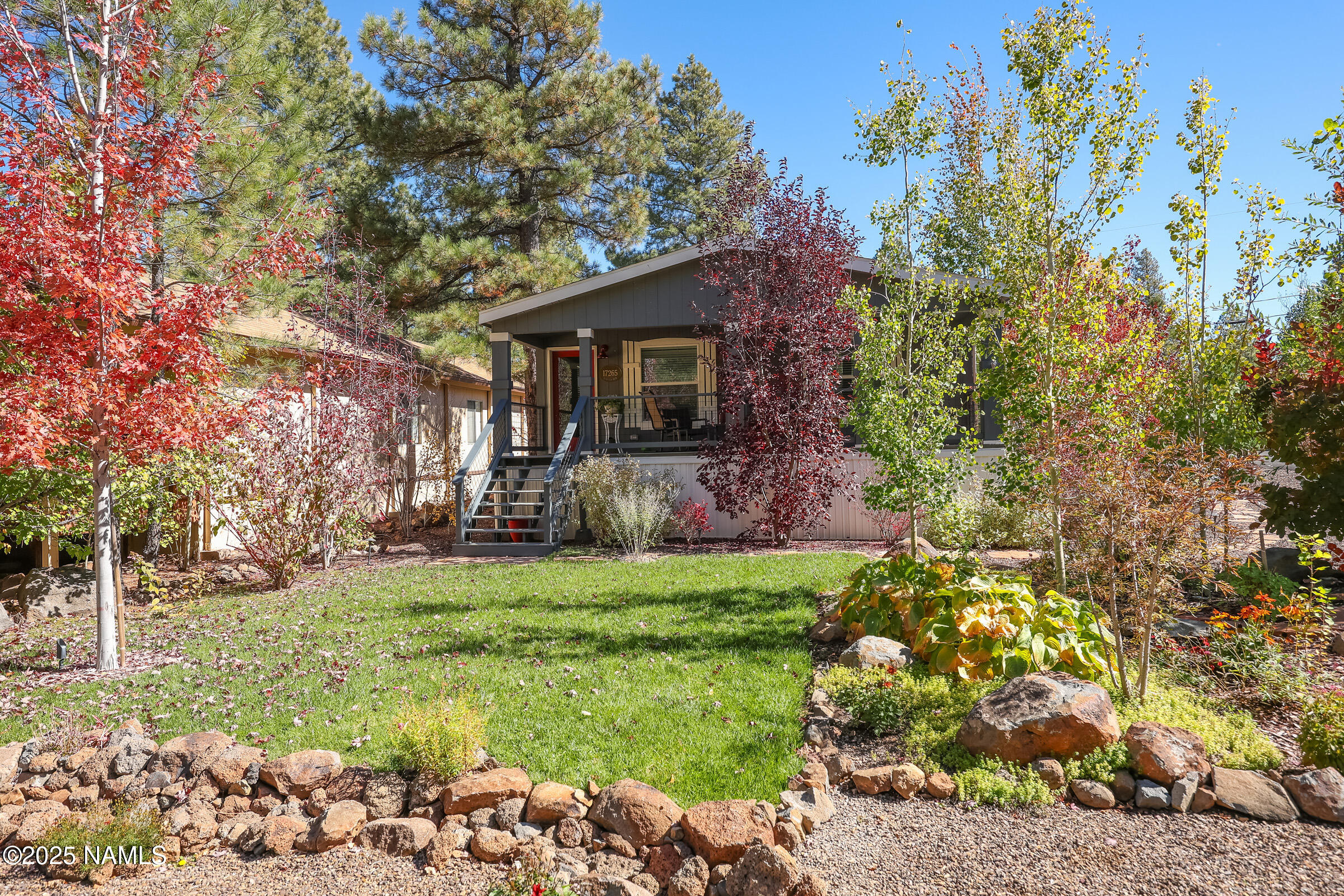 17265 Buffalo Run Munds Park, AZ 86017 - Photo 41 of 51 a backyard of a house with lots of green space